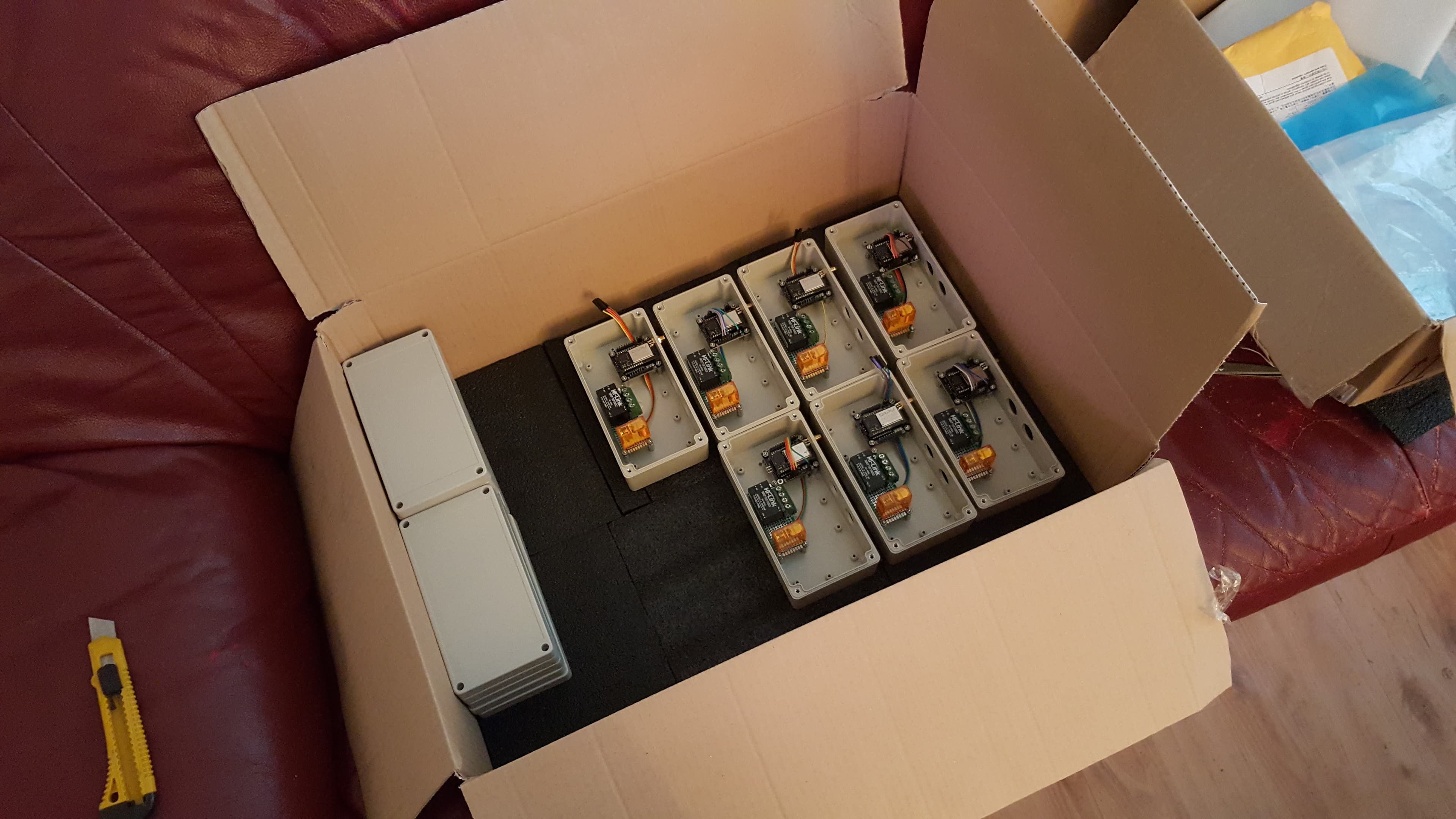 A full box of eight assembled units ready to ship